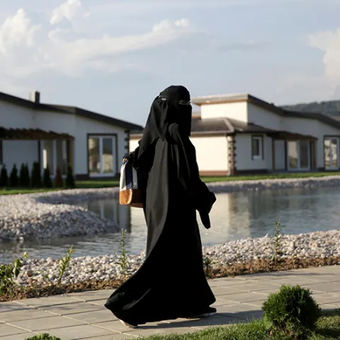 A tourist from the Middle East walks through Sarajevo Resort in Osenik near Sarajevo, Bosnia and Herzegovina, August 10, 2016. Picture taken August 10, 2016. REUTERS/Dado Ruvic