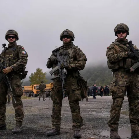 Polish soldiers part of NATO-led international peacekeeping force in Kosovo KFOR next to a road barricade set up by ethnic Serbs near the town of Zubin Potok, on 1 August 2022